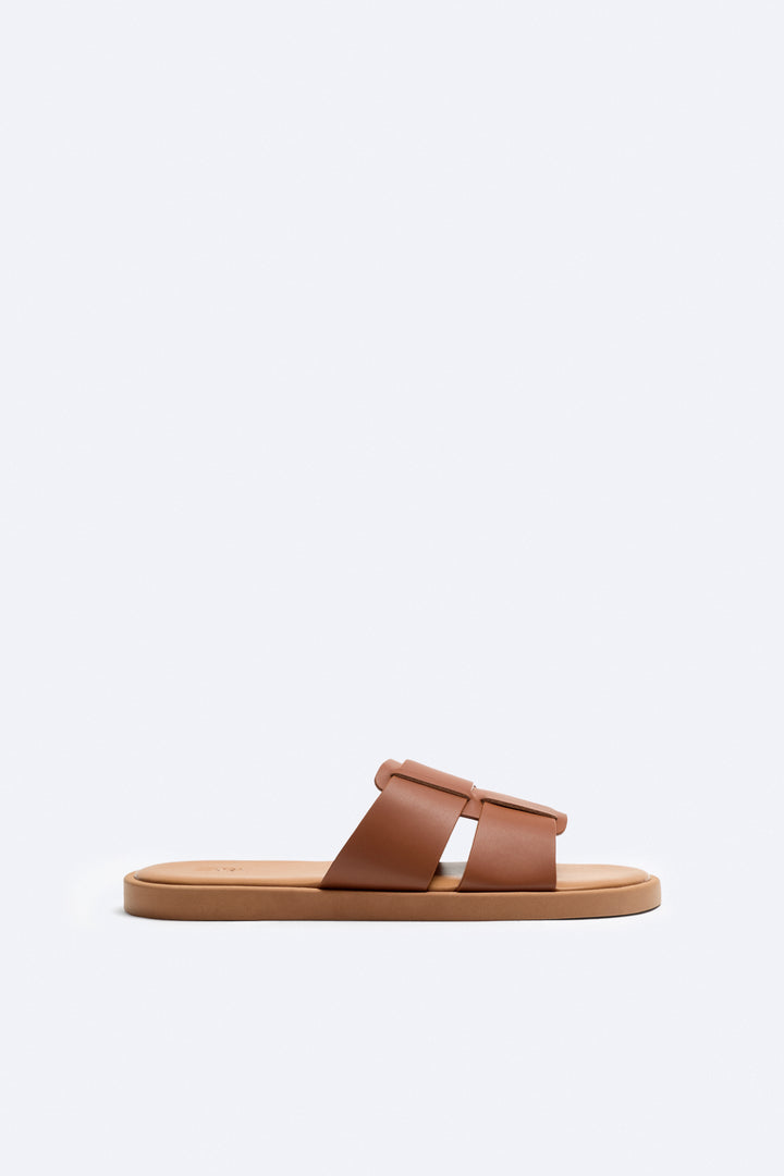 Pala en cuir tressé